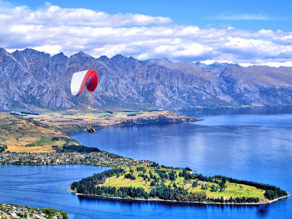 Adventure Travel Bucket List: 15 Thrilling Experiences You Must Try 9 Paragliding Over Queenstown, New Zealand
